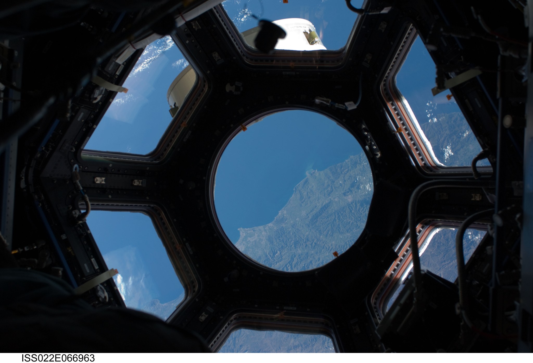 This photo, one of the first taken through the Cupola of the International Space Station, shows the coast of Algeria.