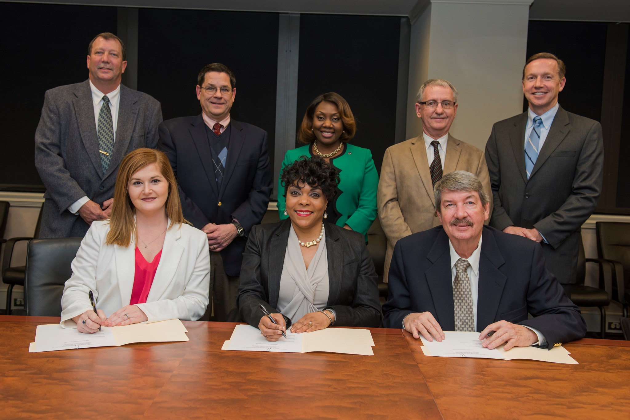 Executives from URS Federal Services, Inc., and Seabrook Solutions, LLC Inc. sign a NASA Mentor-Protégé Agreement on Feb. 18.