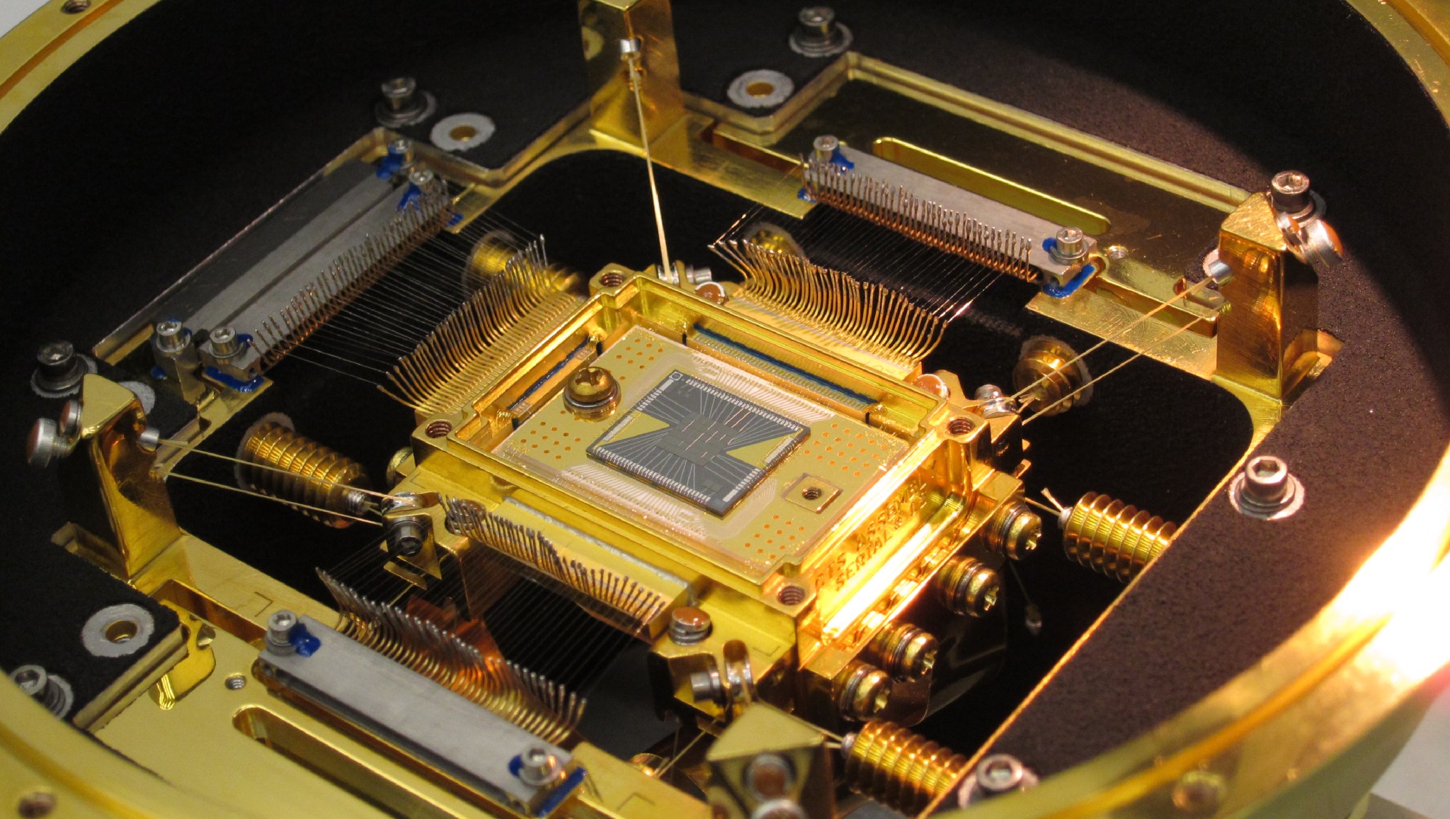 The heart of the ASTRO-H Soft X-ray Spectrometer is the microcalorimeter array at center. 