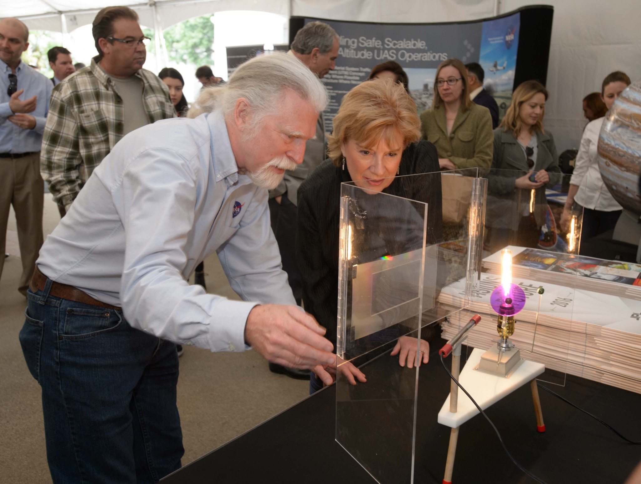 man shows display to woman