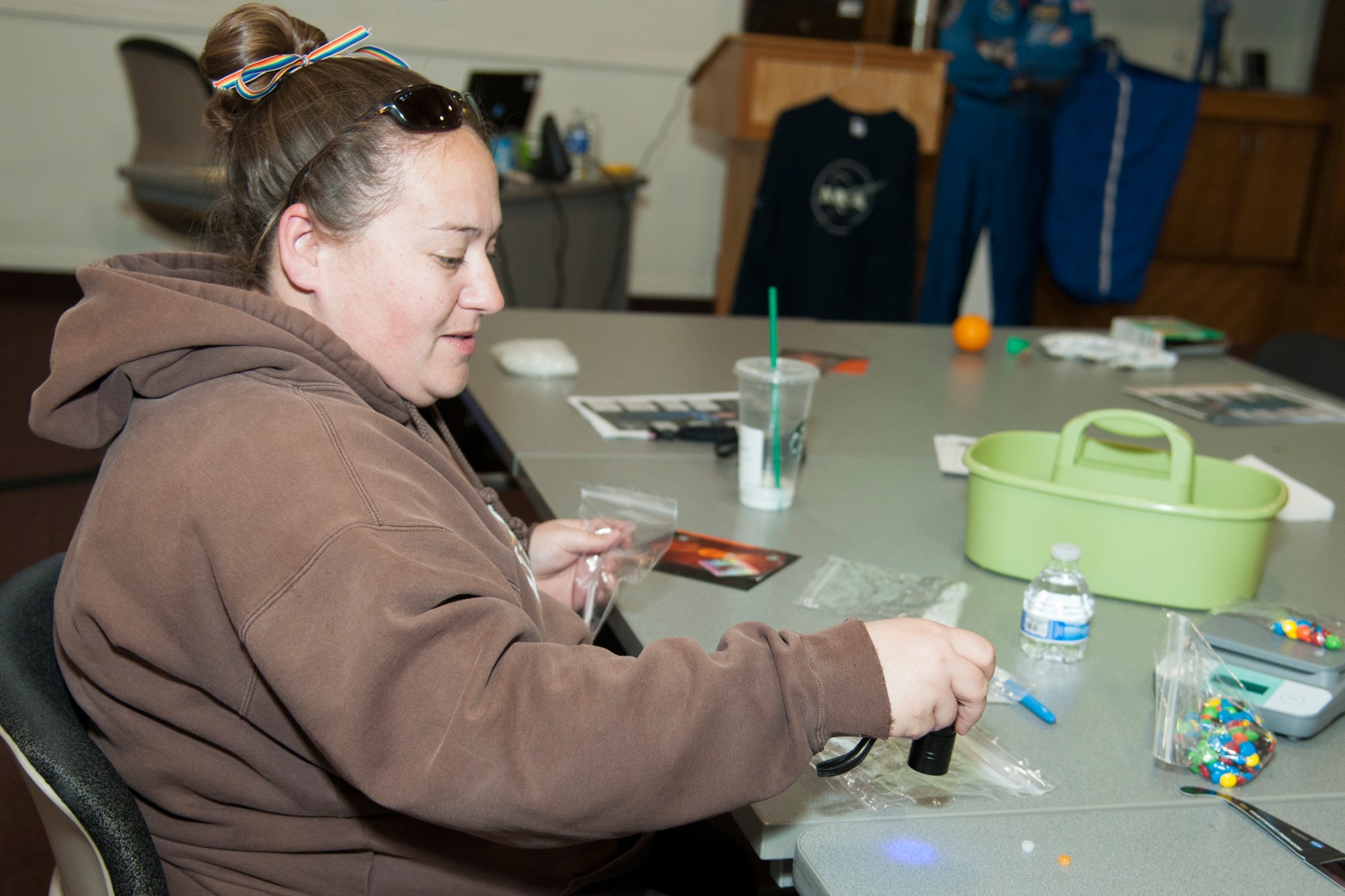 Informal educator Jill Rowe uses an ultraviolent light.