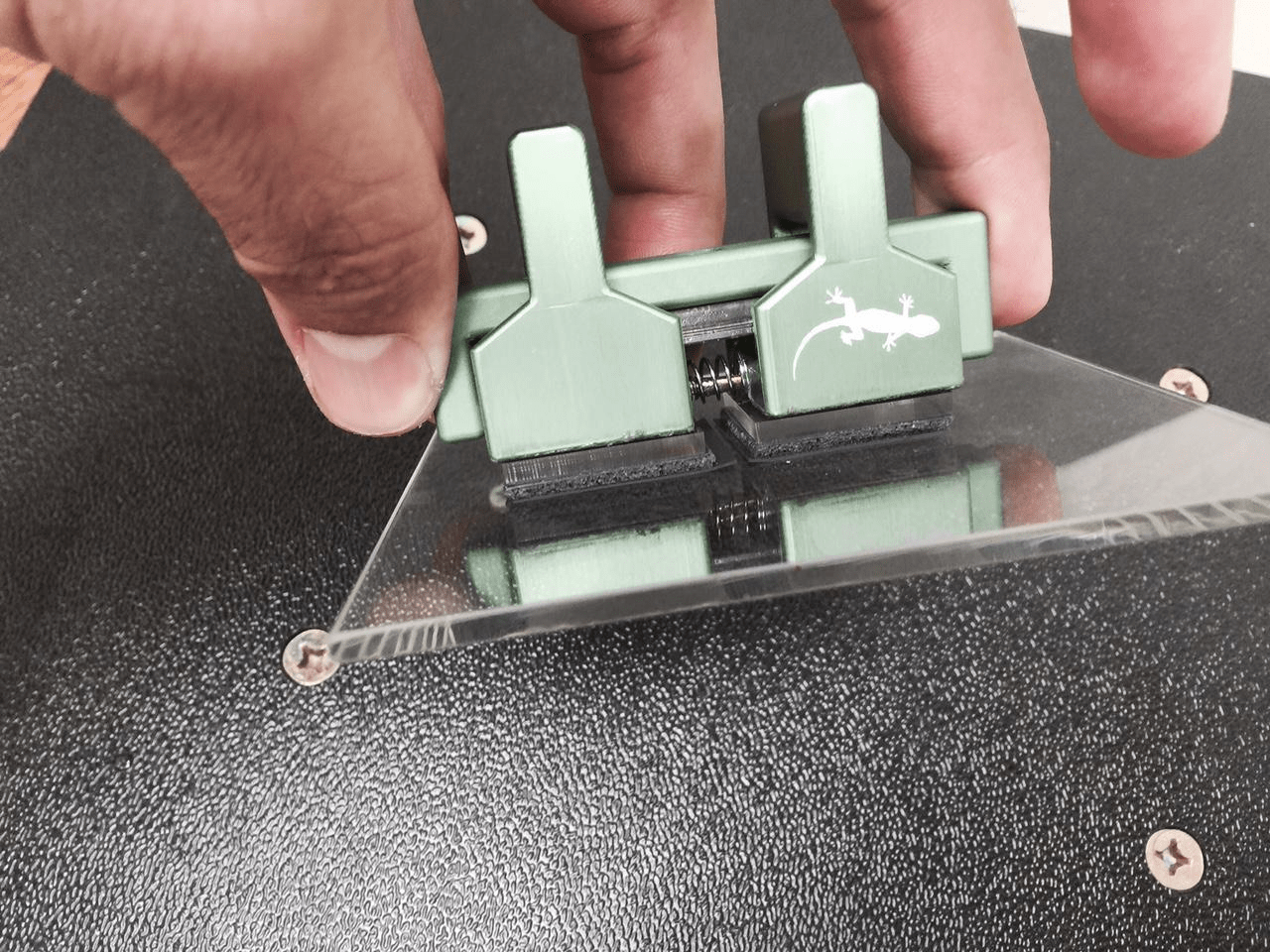 Small handheld gecko grippers and associated test hardware.