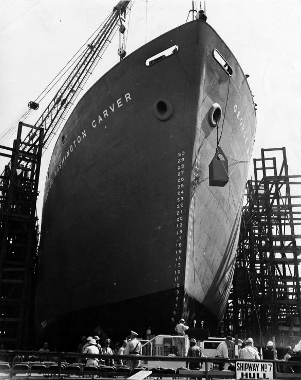 black and white prow of ship with people, scaffolding