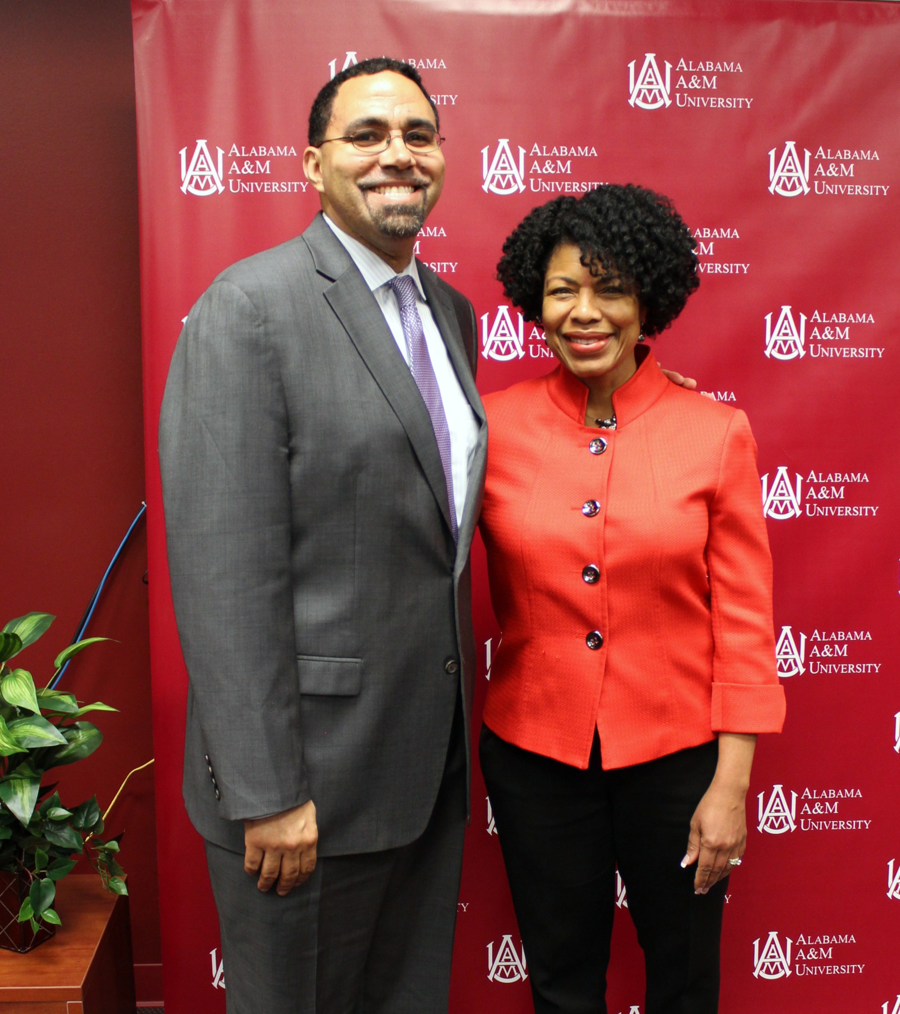 U.S. Secretary of Education John King Jr., left, greets Sheila Nash-Stevenson of Marshall’s Planetary Missions Program Office. 