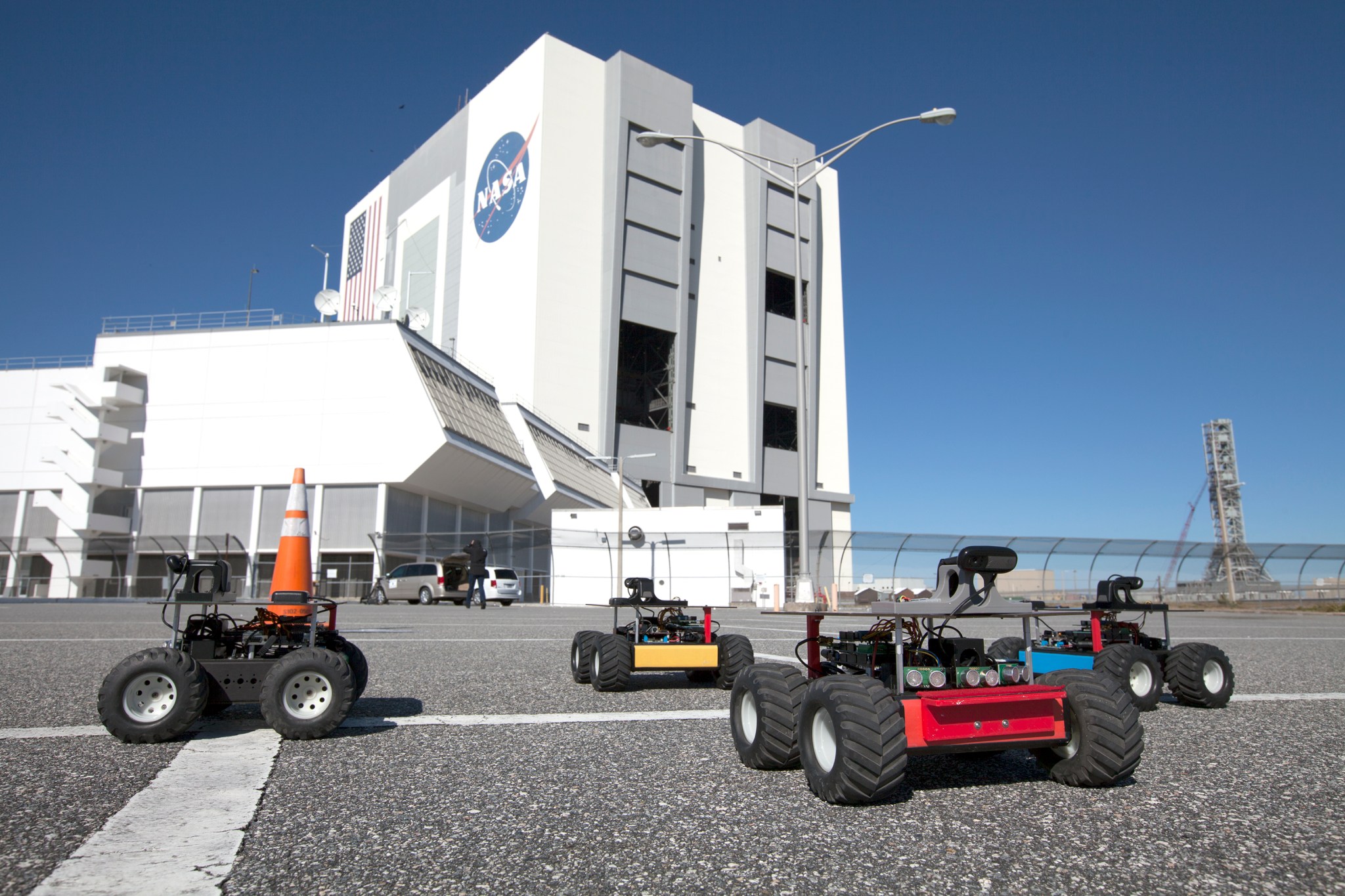 Swarming robots in front of the Vehicle Assembly Building