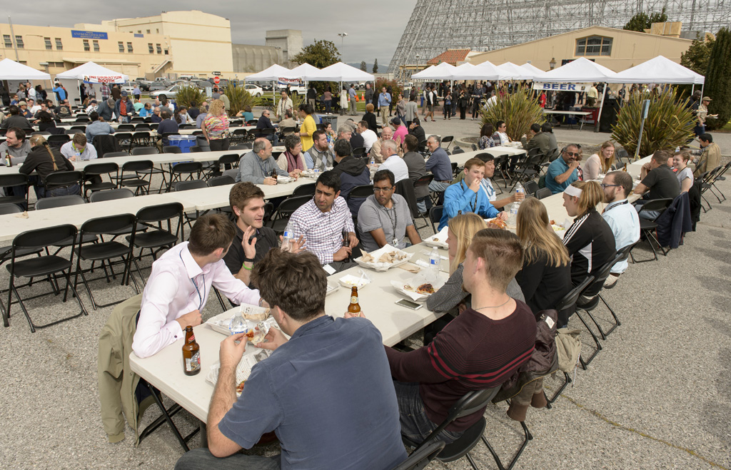 Employees enjoy pizza at the 1st Annual Ames Innovation Fair March 3, 2016
