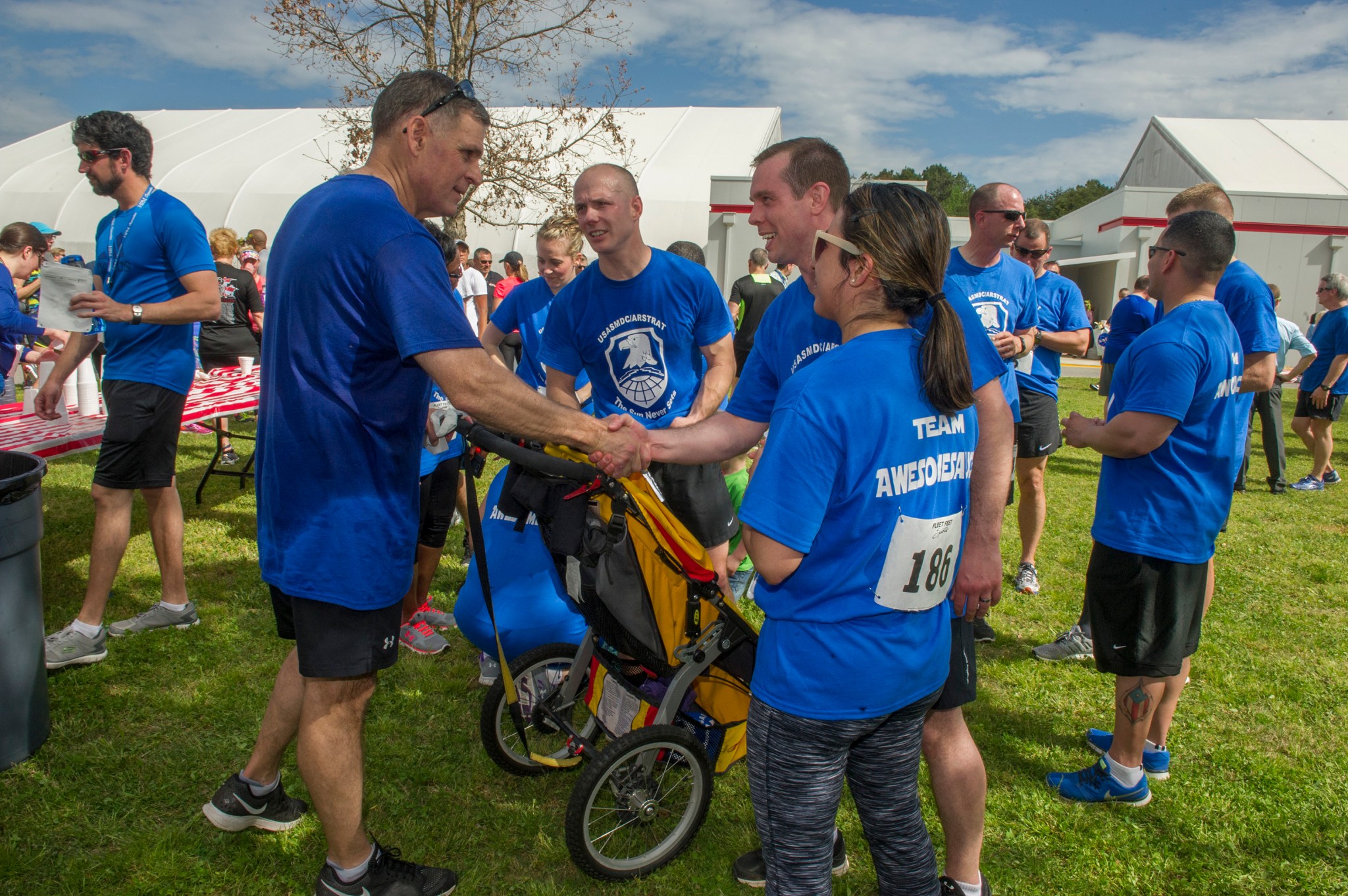 Lieutenant-General David L. Mann, front left, greets fellow participants in the 9th annual MSFC Running Club’s 5K.