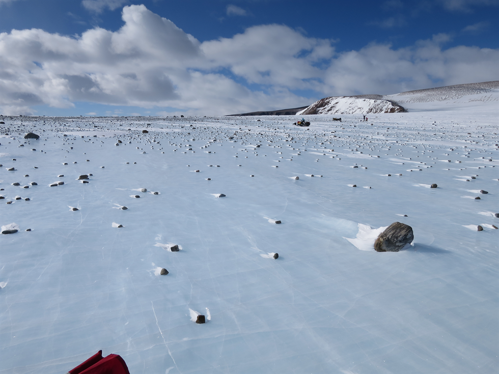 lue ice field in the Miller Range, near the edge of a moraine. Moraines are piles of rocks deposited along the edge of a glacier
