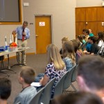 Kennedy Space Center Director Bob Cabana talks to children during Take a Child to Work Day.