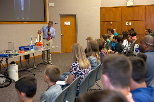 Kennedy Space Center Director Bob Cabana talks to children during Take a Child to Work Day.