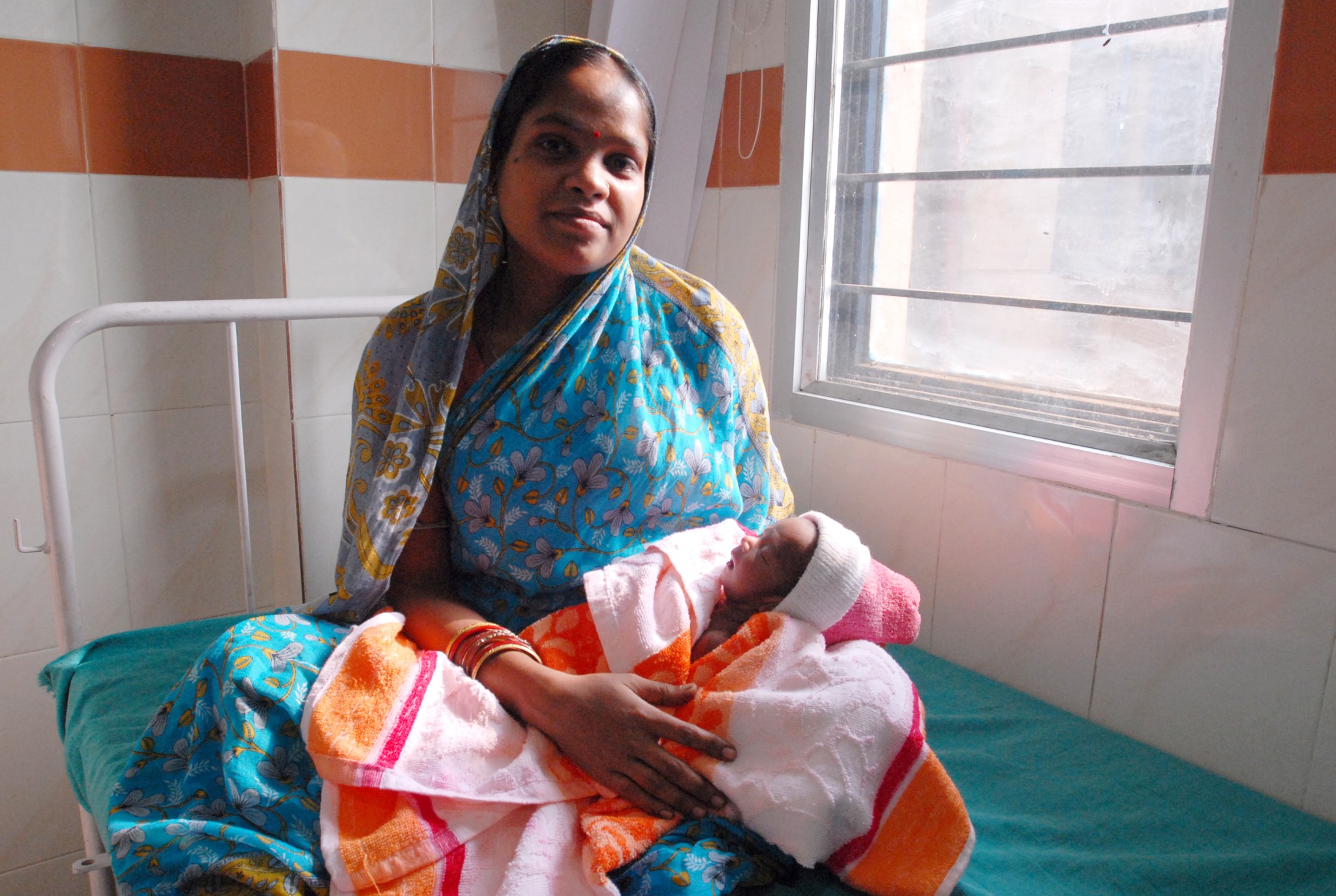 A woman holding a baby