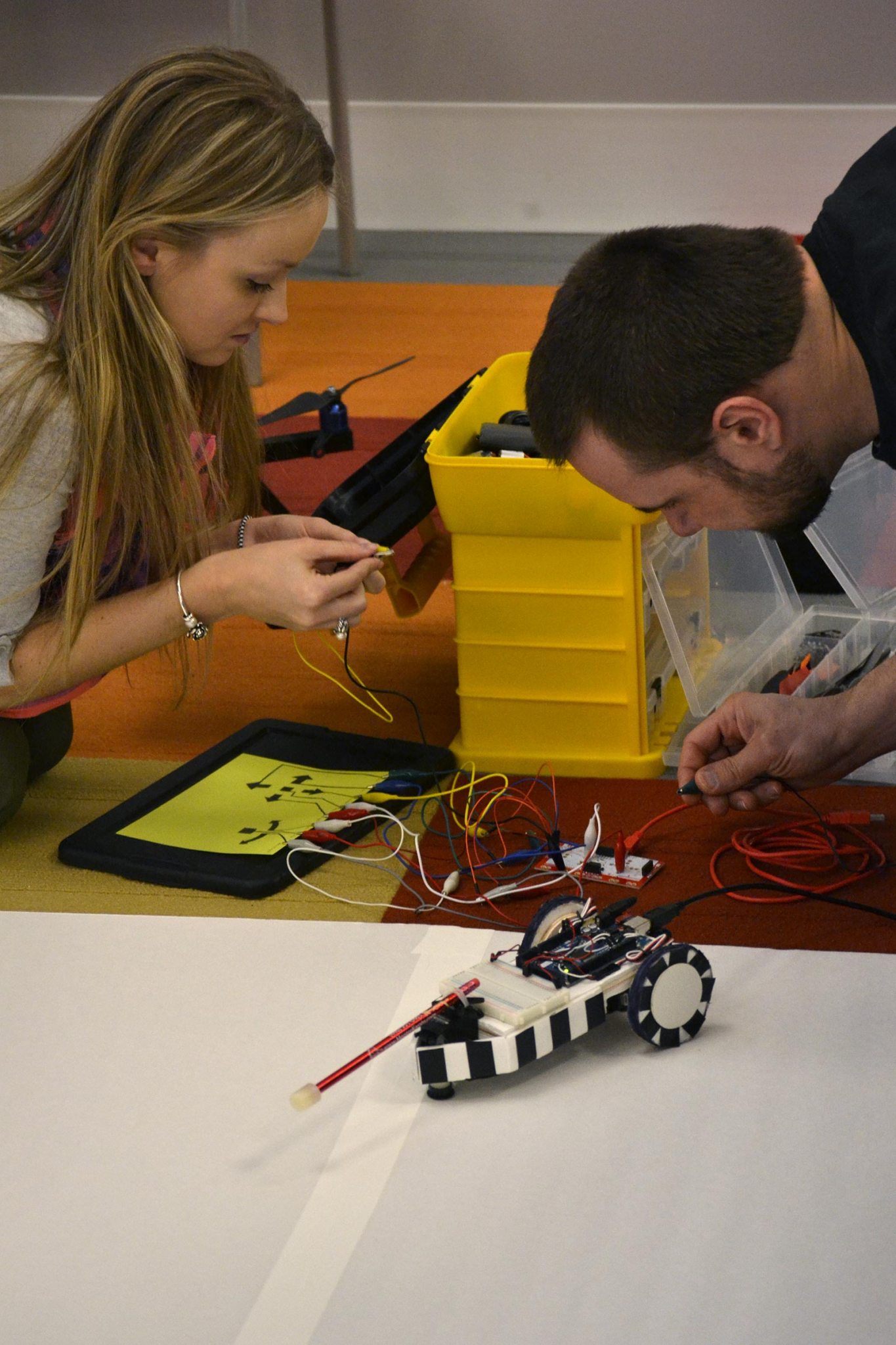 During the 2015 Space Apps Challenge event held at NASA Glenn, two participants work together on a challenging project.