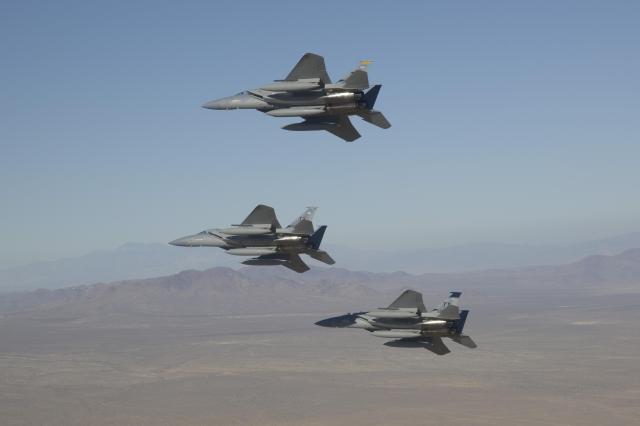 Three aircraft in flight formation.