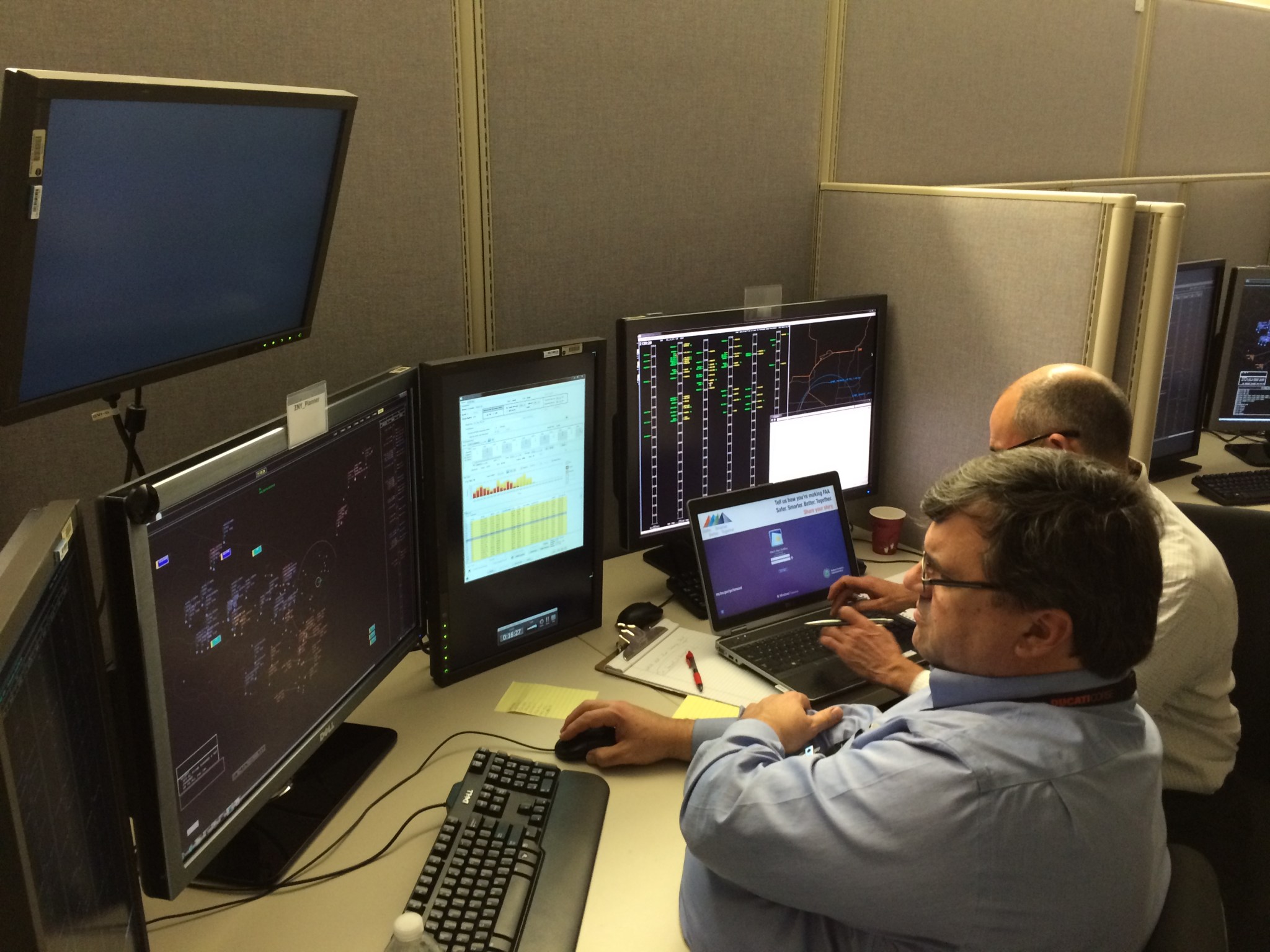 NASA researchers monitoring the air traffic management simulation.