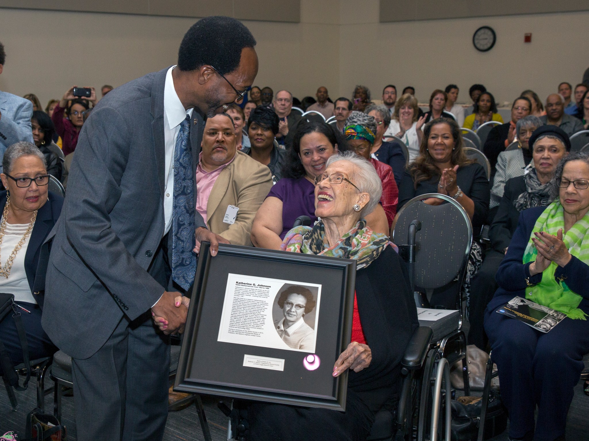 NASA Langley Deputy Center Director Clayton Turner presents a plaque to Katherine G. Johnson.