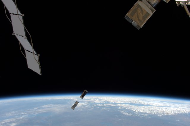 MinXSS CubeSat deployment from ISS with the Earth in the background.