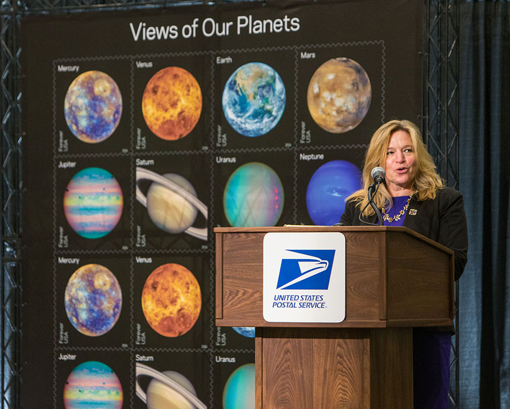 NASA Chief Scientist Ellen Stofan addresses a crowd of stamp aficionados