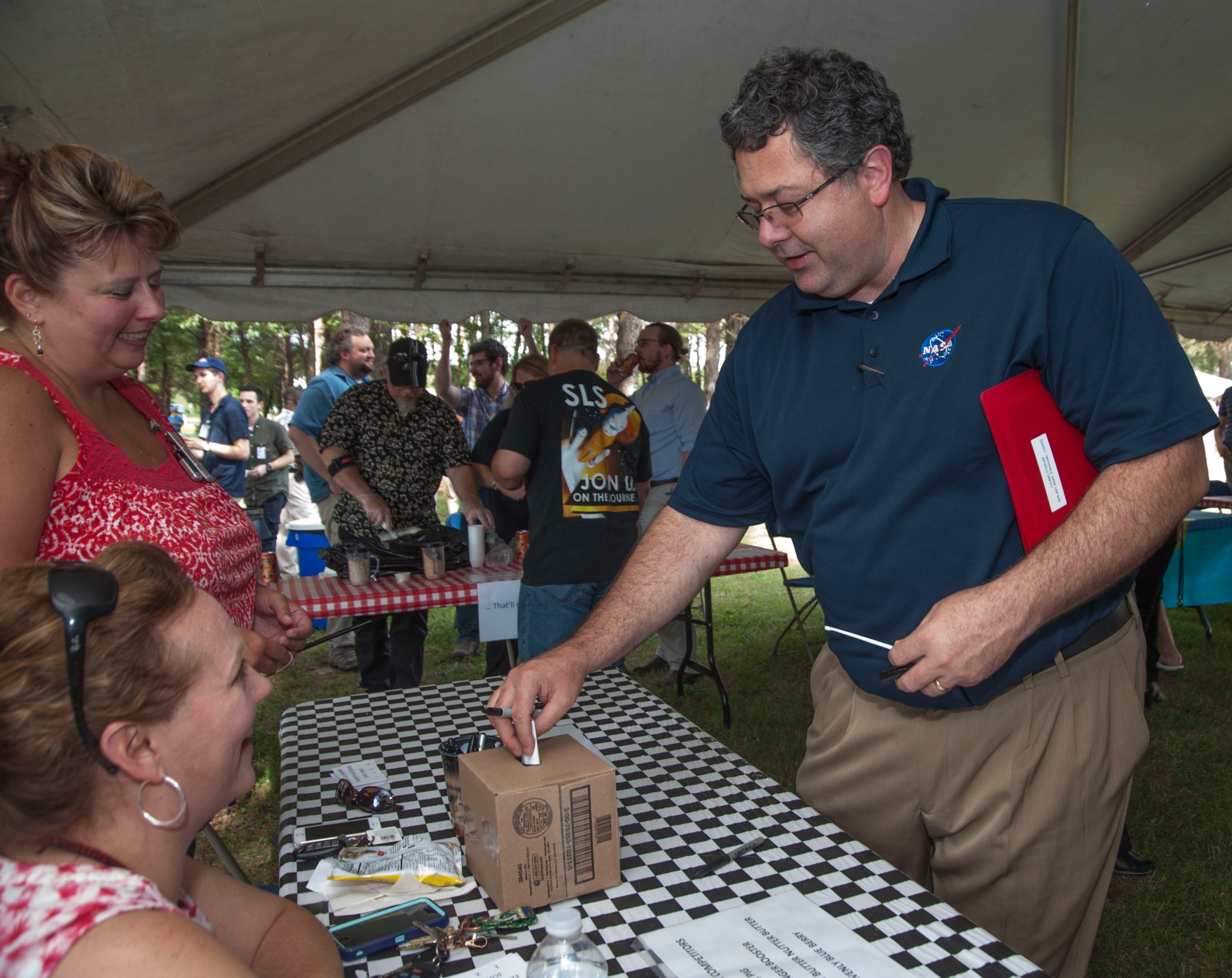 Marshall Space Flight Center Director Todd May casts his ballot in the homemade ice cream contest.