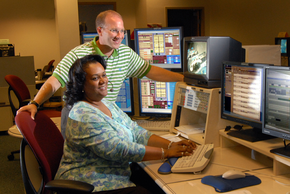 Lybrease Woodard and coworker Joey Pirani test computer systems that simulate International Space Station operations. The simulations prepare flight controllers and other team members who work with space crews to conduct complex experiments.
