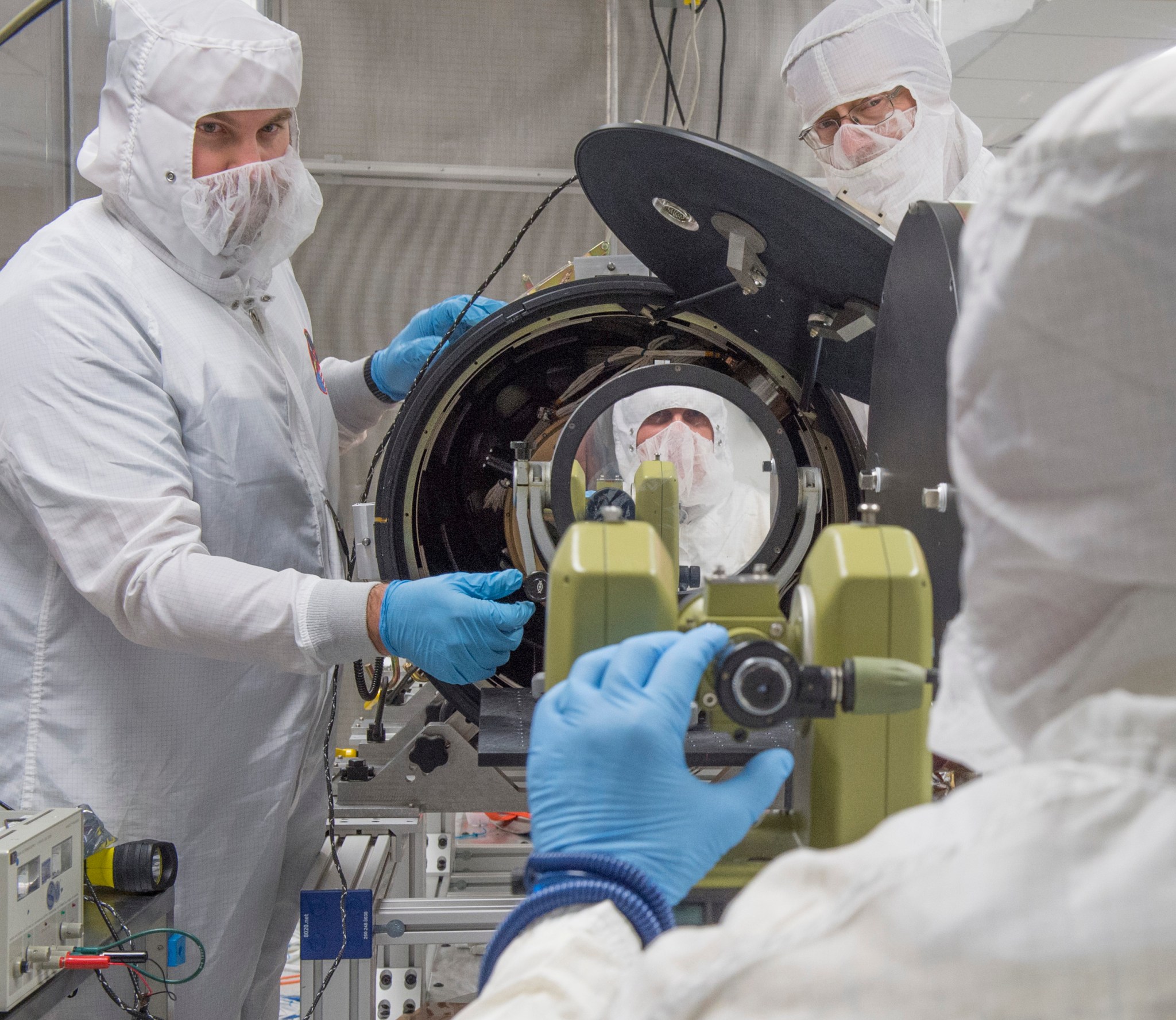 Patrick Champey , Richard Gates and William Podgorski complete an alignment procedure on the Hi-C instrument.