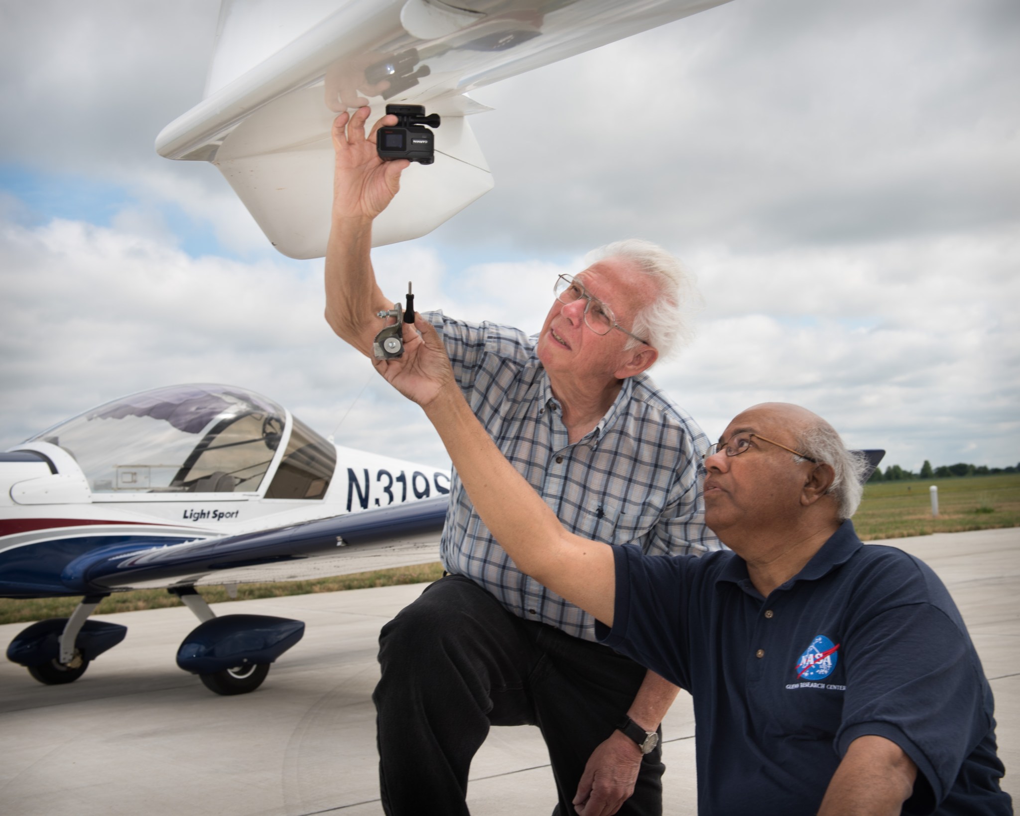 NASA Glenn’s Dr. Rafat Ansari (right) and Pilot Terry Schubert 