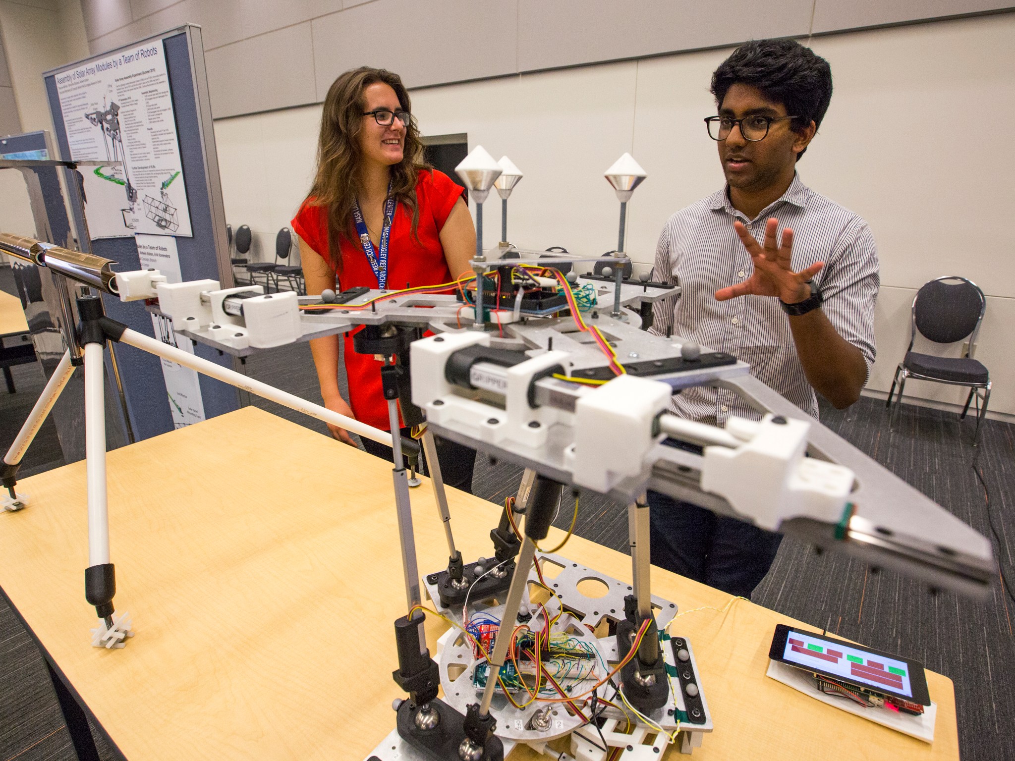 NASA Langley interns Samantha Glassner and Ashwin Kishen stand