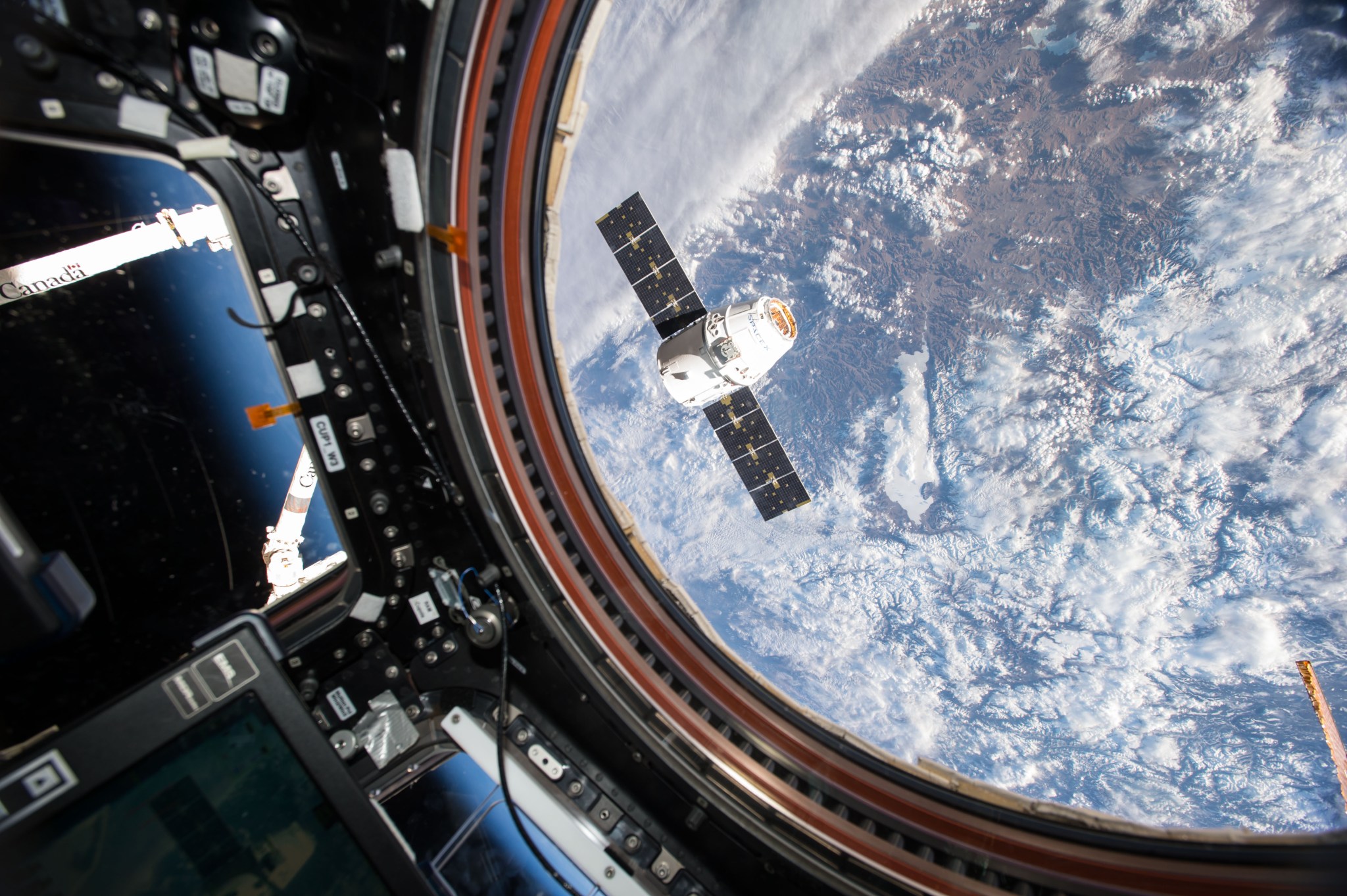 NASA astronaut Tim Kopra captured this image of the SpaceX Dragon spacecraft from the Cupola Module of the International Space S