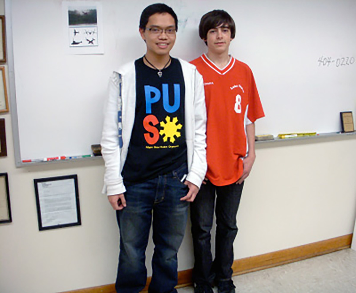 1st place team photo, two males teens in front of the dry board.