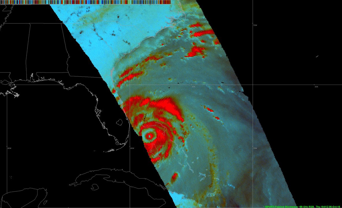 A double eye-wall structure captured of Hurricane Matthew, with the spiraling clouds highlighted in red.