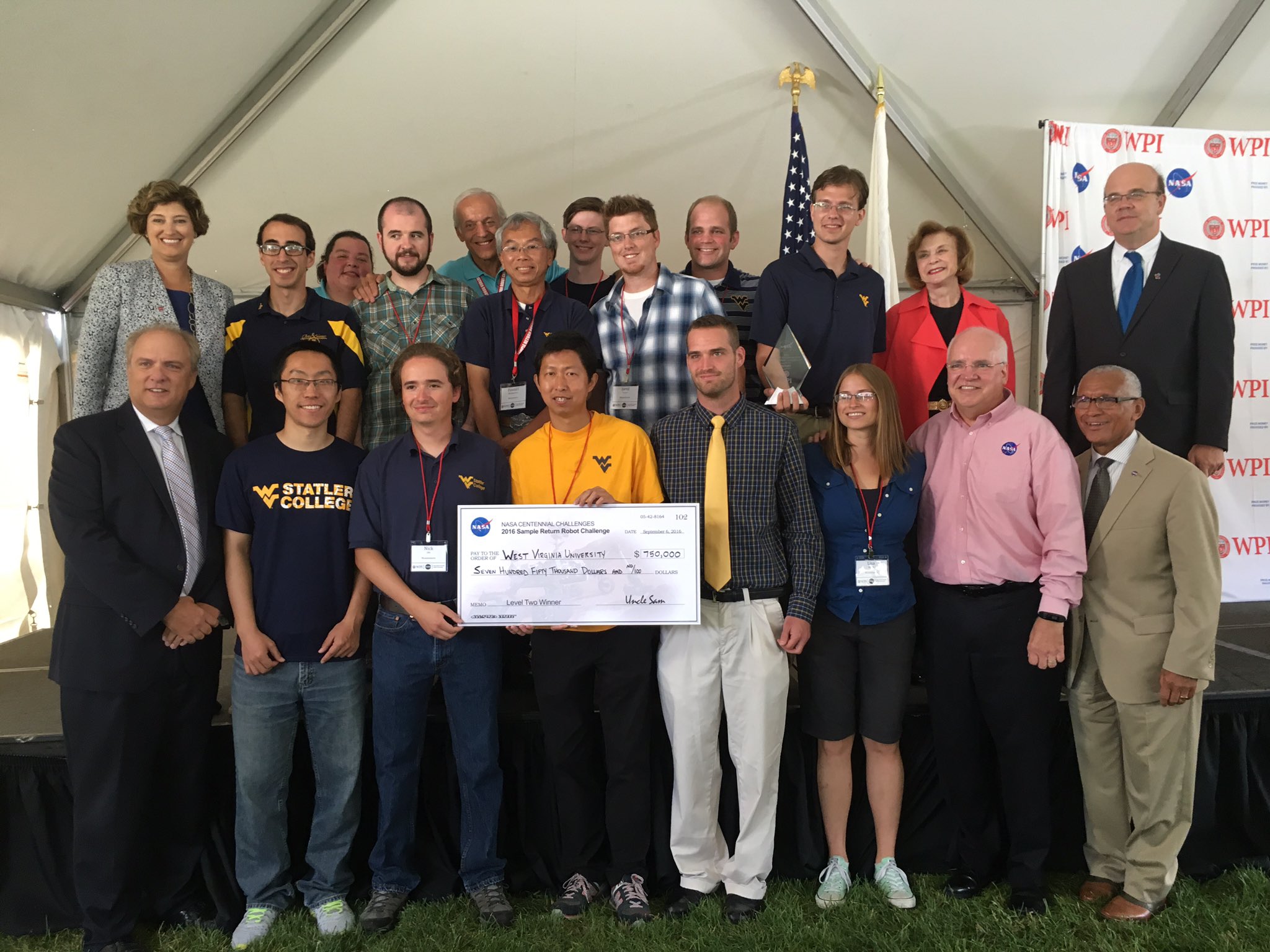 The West Virginia University Mountaineers receive an award check for $750,000 at the 2016 Sample Return Robot Challenge Level 2.