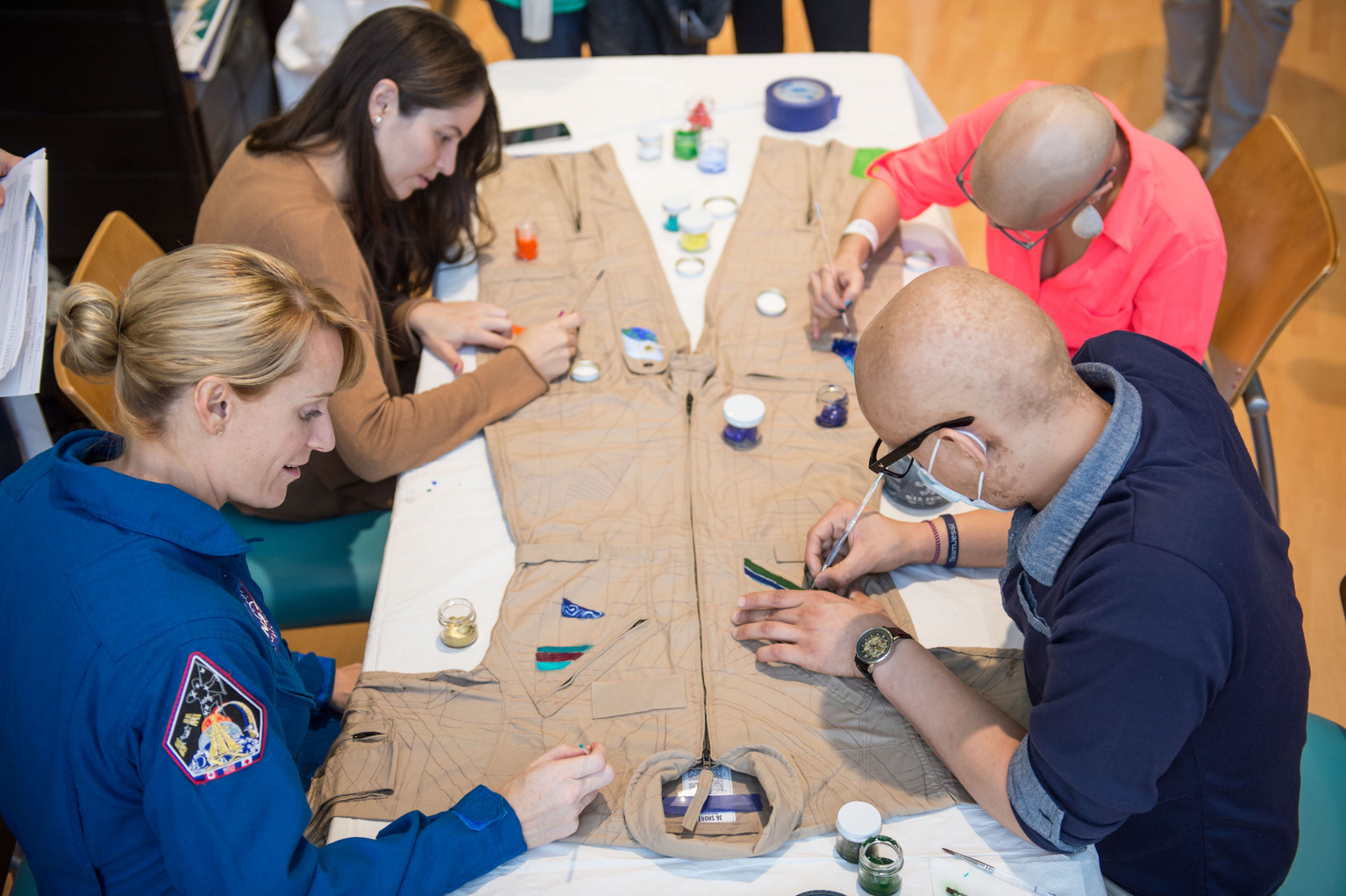 Kate Rubins Works on MD Anderson Cancer Center Spacesuit