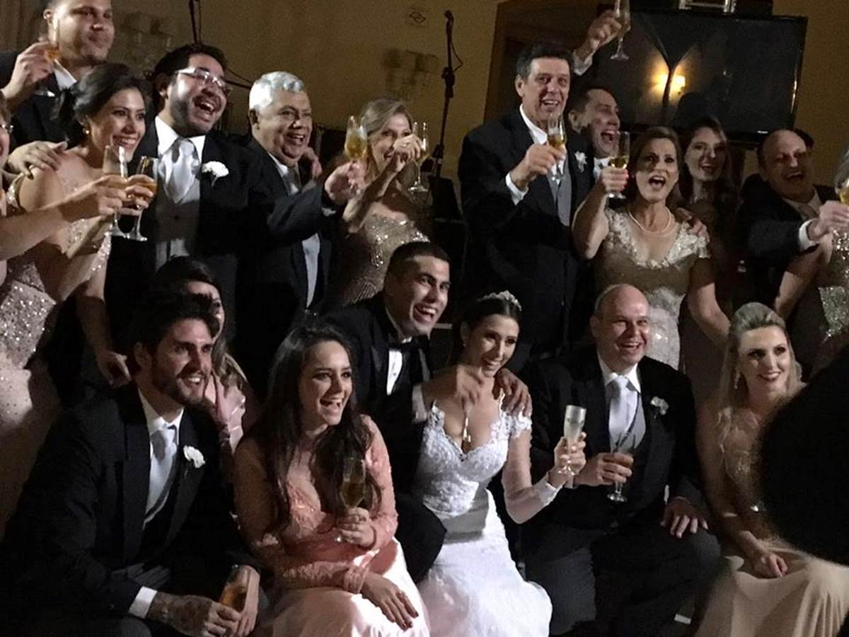 The wedding party poses for photos and toasts the new couple.