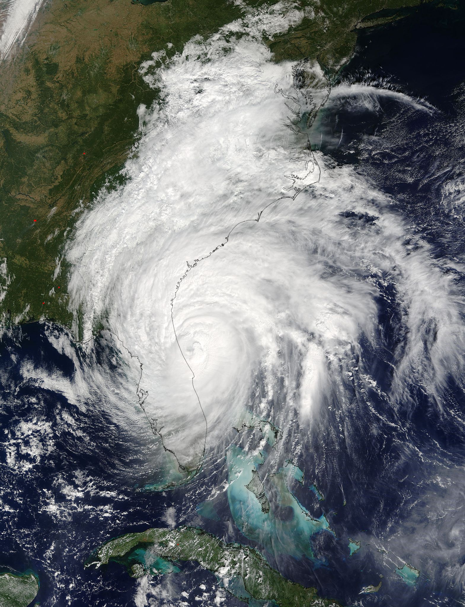 Terra image of Matthew, a huge spiral cloud over the US Atlantic coast.
