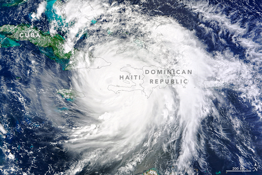 Terra image of Matthew, a spiraling mass of clouds over Haiti and the Dominican Republic.