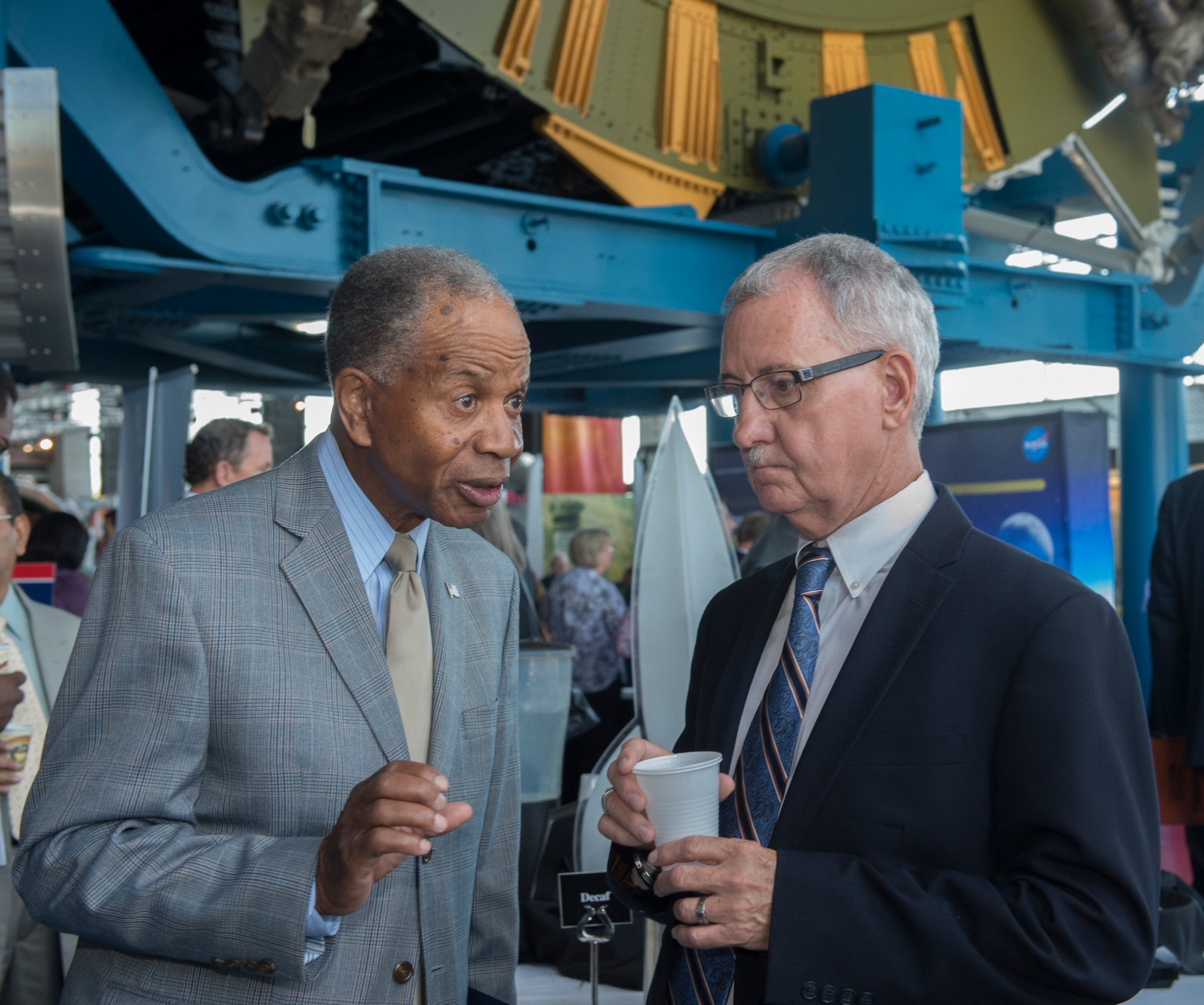 Dr. Marvin Carroll, left, president of Tec-Masters Inc., speaks with David Brock, small business specialist at NASA Marshall.