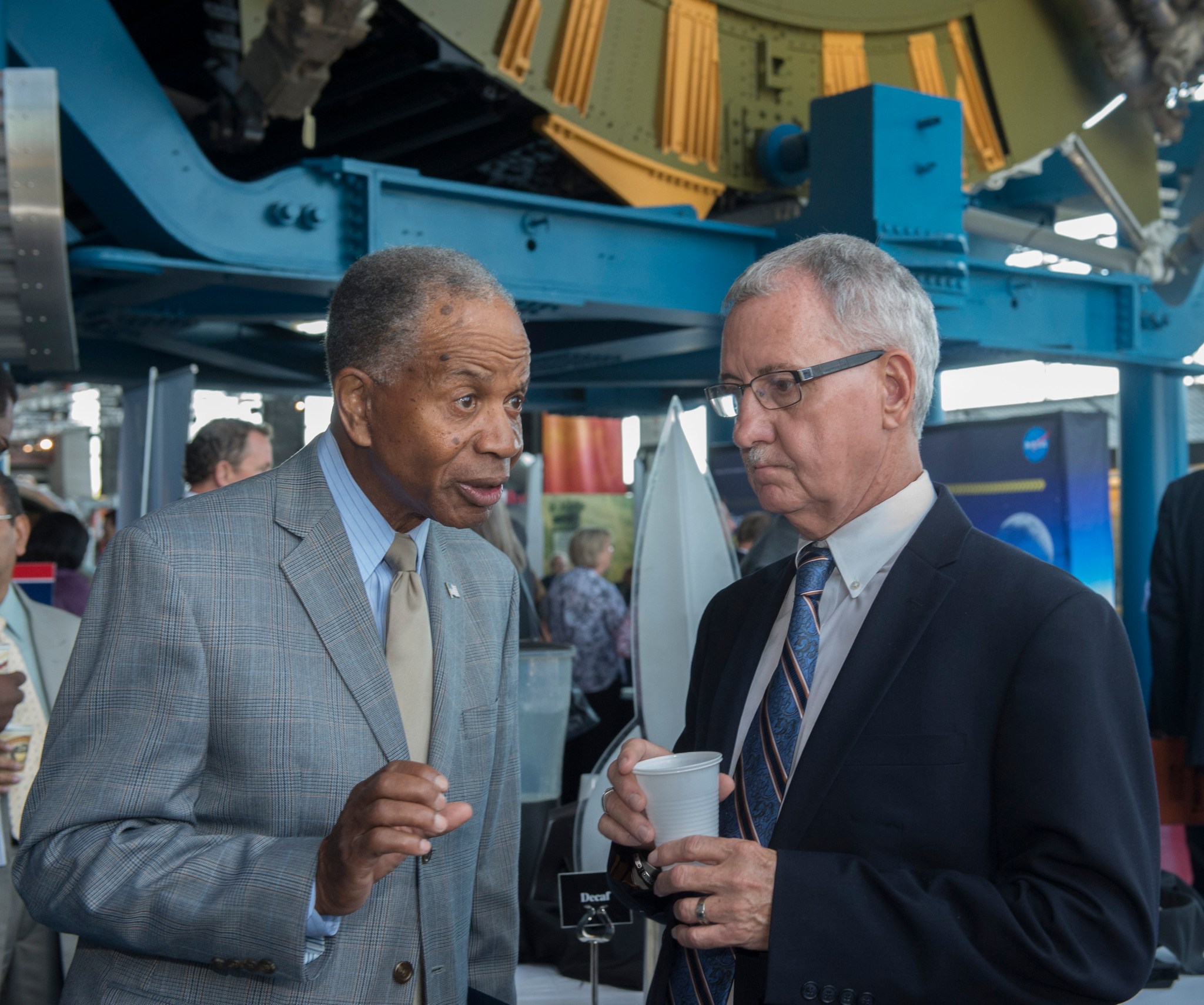 Dr. Marvin Carroll, left, president of Tec-Masters Inc., speaks with David Brock, small business specialist at NASA Marshall.