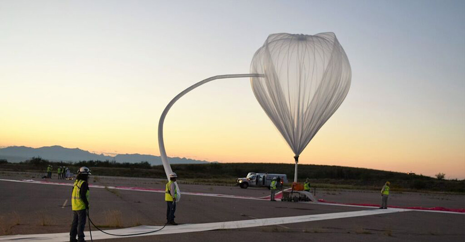 Preparing high-altitude balloon to carry solar observatory research payload into the stratosphere.