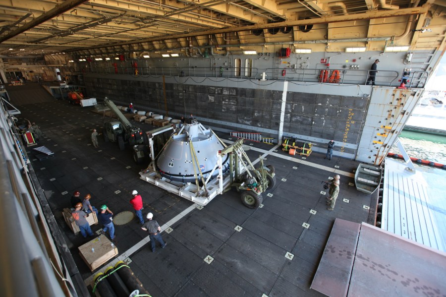The test version of the Orion crew module was transported into the well deck of the USS San Diego at Naval Base San Diego in California on Oct. 21 to prepare for Underway Recovery Test 5.