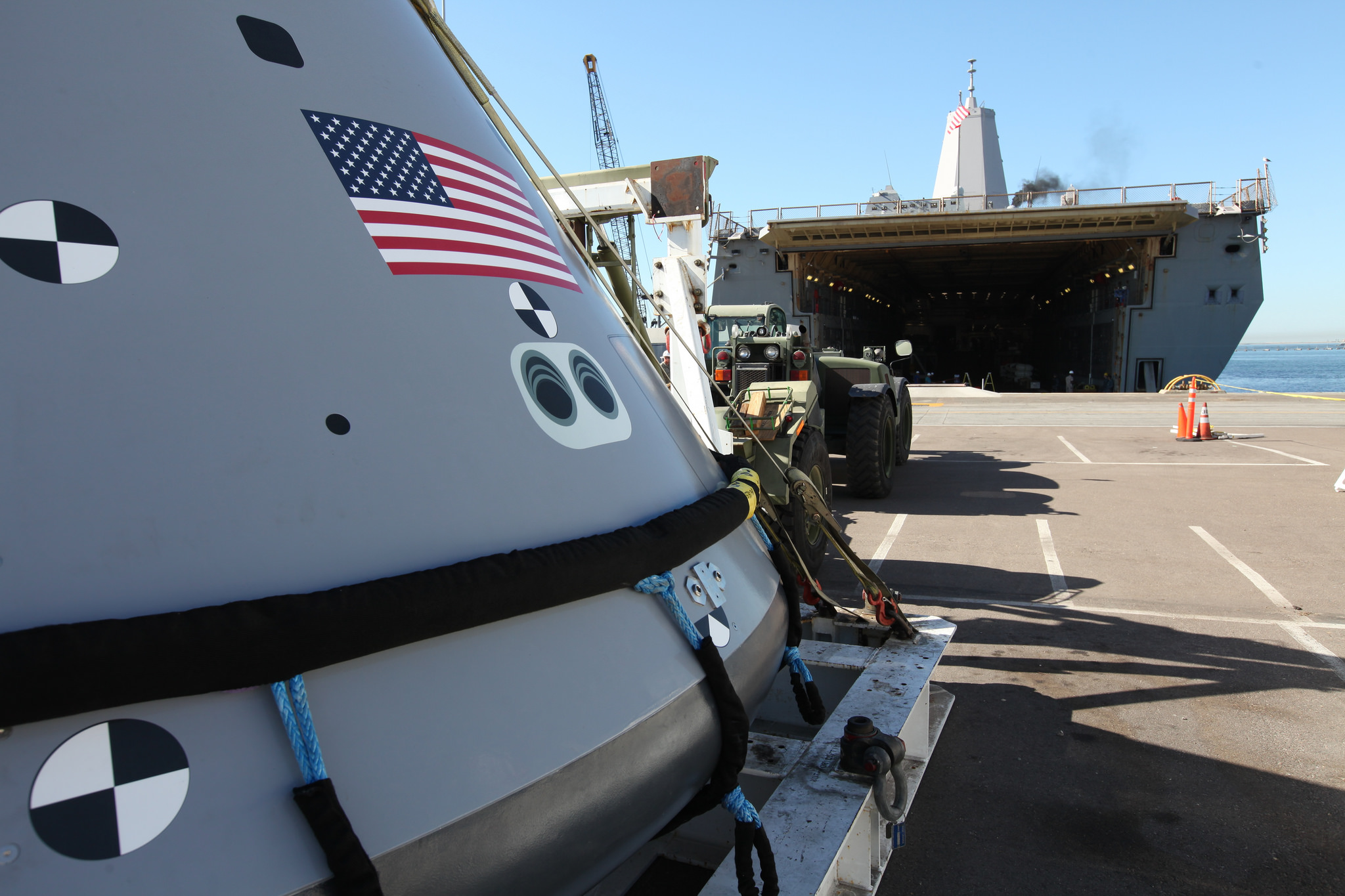 The test version of the Orion crew module is transported to the USS San Diego at Naval Base San Diego in California.