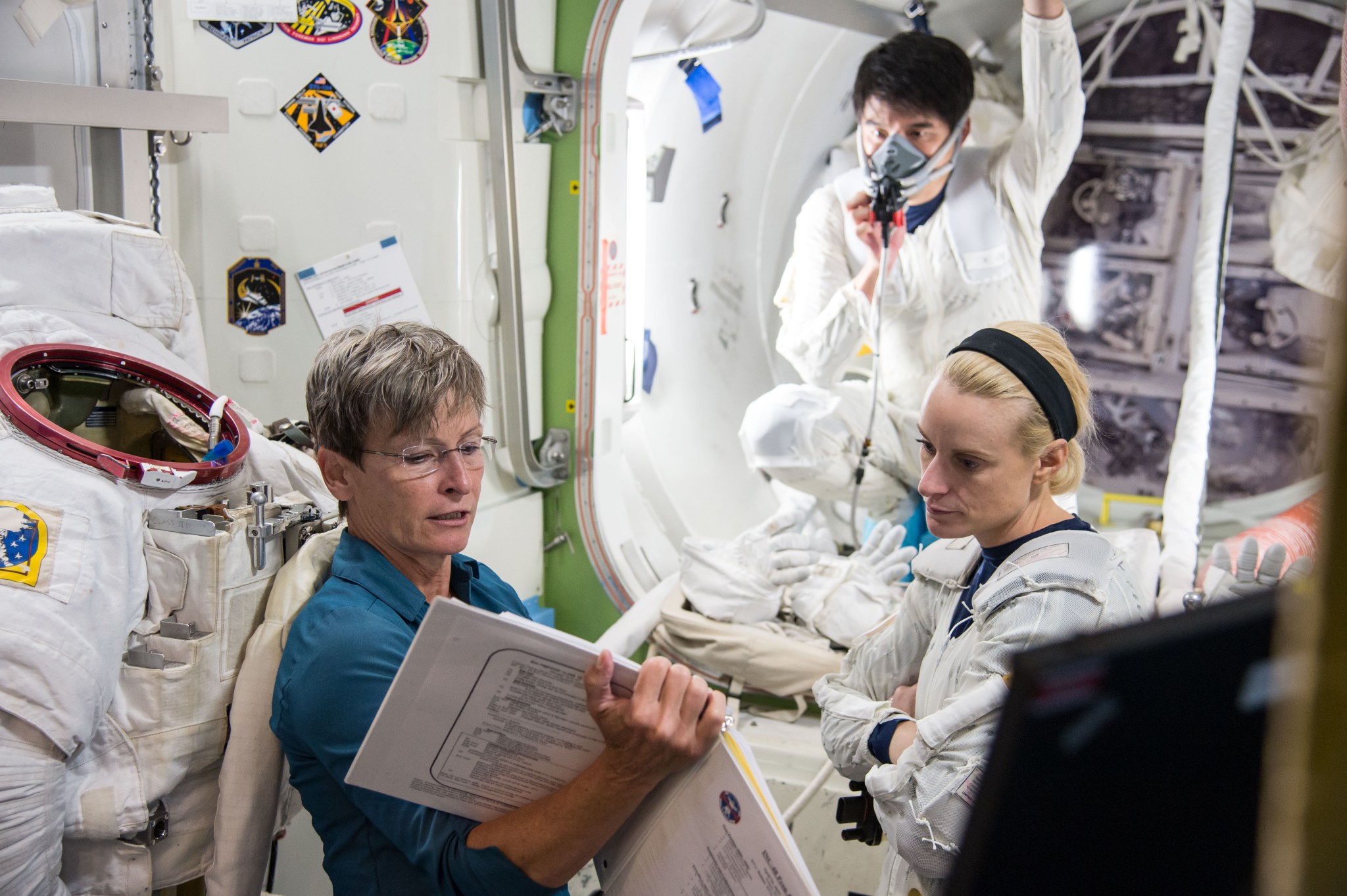 NASA astronauts Peggy Whitson and Kate Rubins, and astronaut Takuya Onishi of the Japan Aerospace Exploration Agency