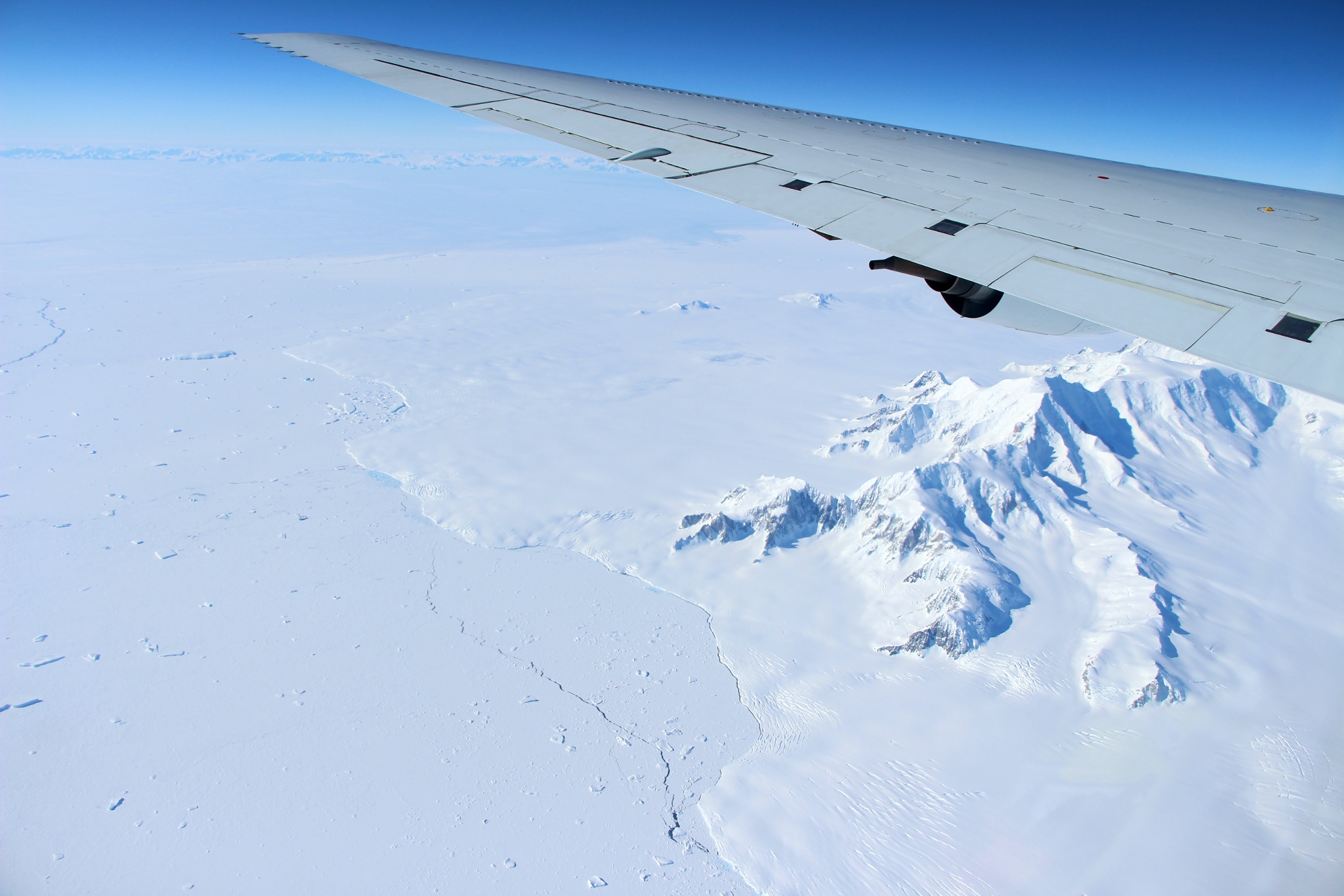 airborne view of mountains and ice