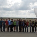 Students pose in front of the 2016 HASP payload.