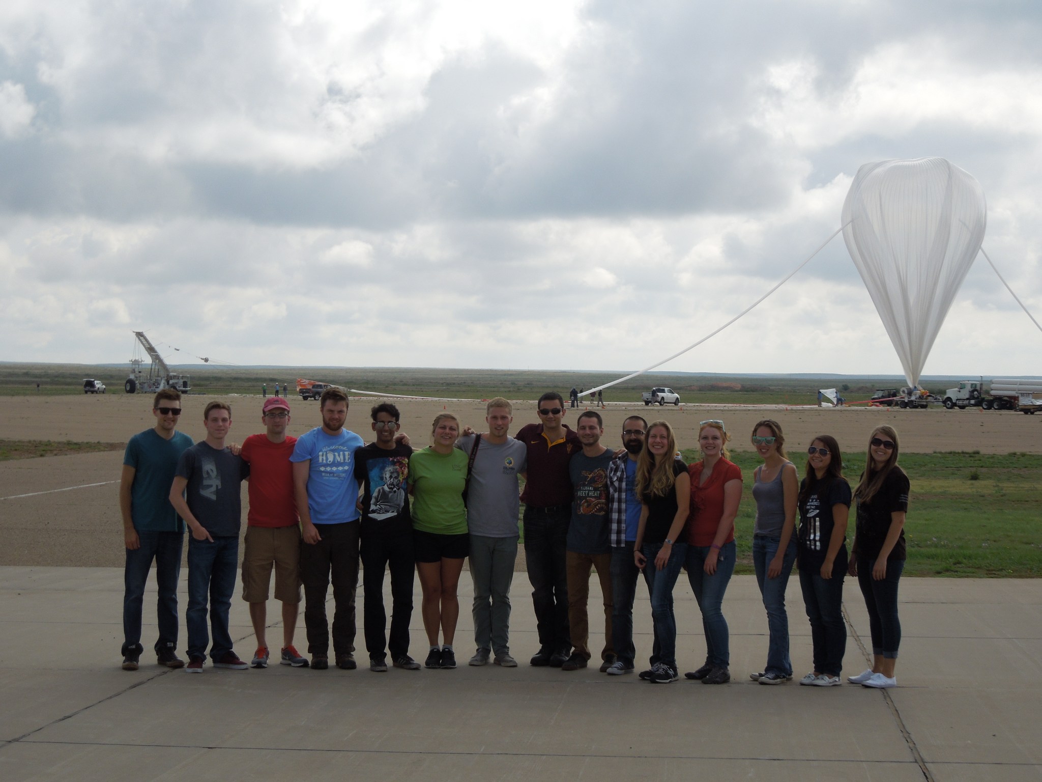 Students pose in front of the 2016 HASP payload.