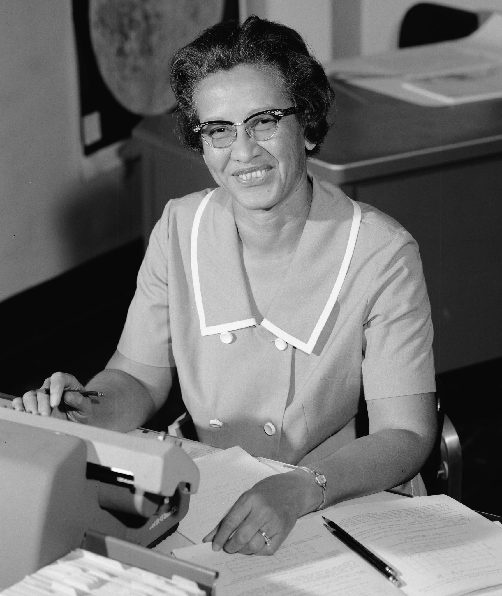 This is a photo of NASA mathematician Katherine Johnson sitting at a desk.