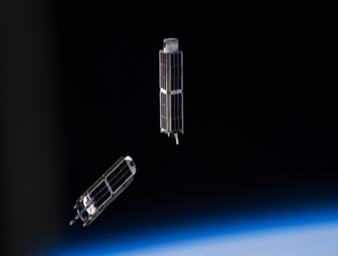 Image of two smallsats in orbit