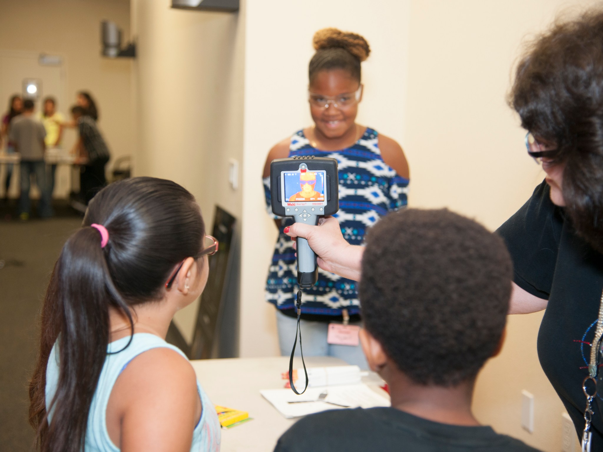 Students use infrared camera to understand the composition and temperatures of their classmates.