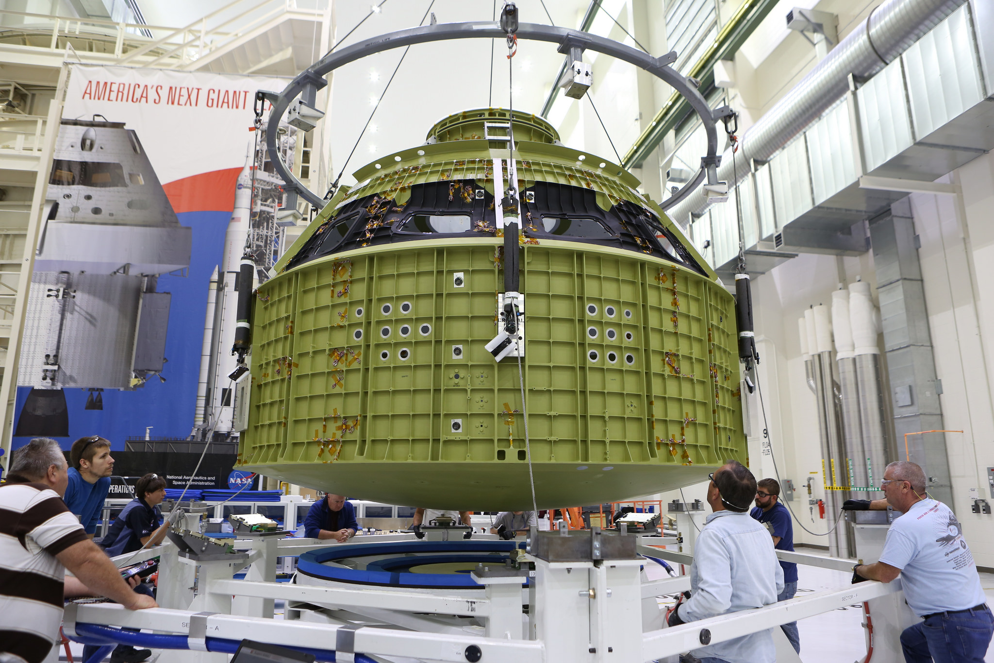 A Crane Lowers the Orion Crew Module Structural Test Article