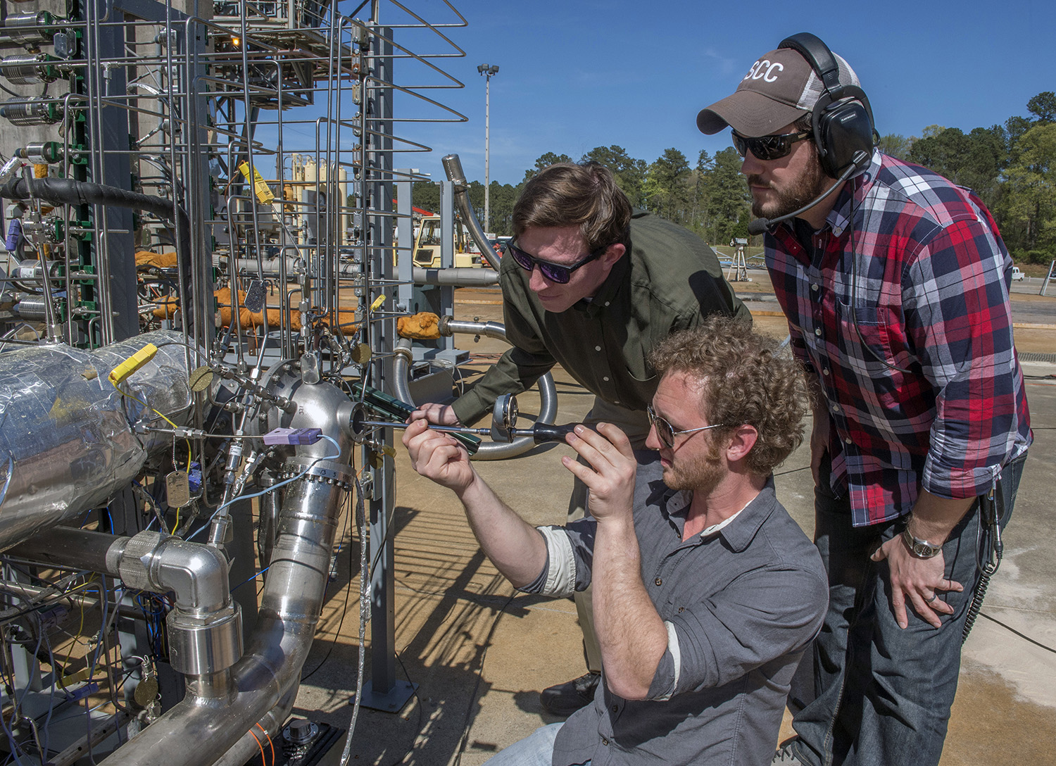 Engineers prepare a 3-D printed turbopump for a test at NASA’s Marshall Space Flight Center in Huntsville, Alabama. 