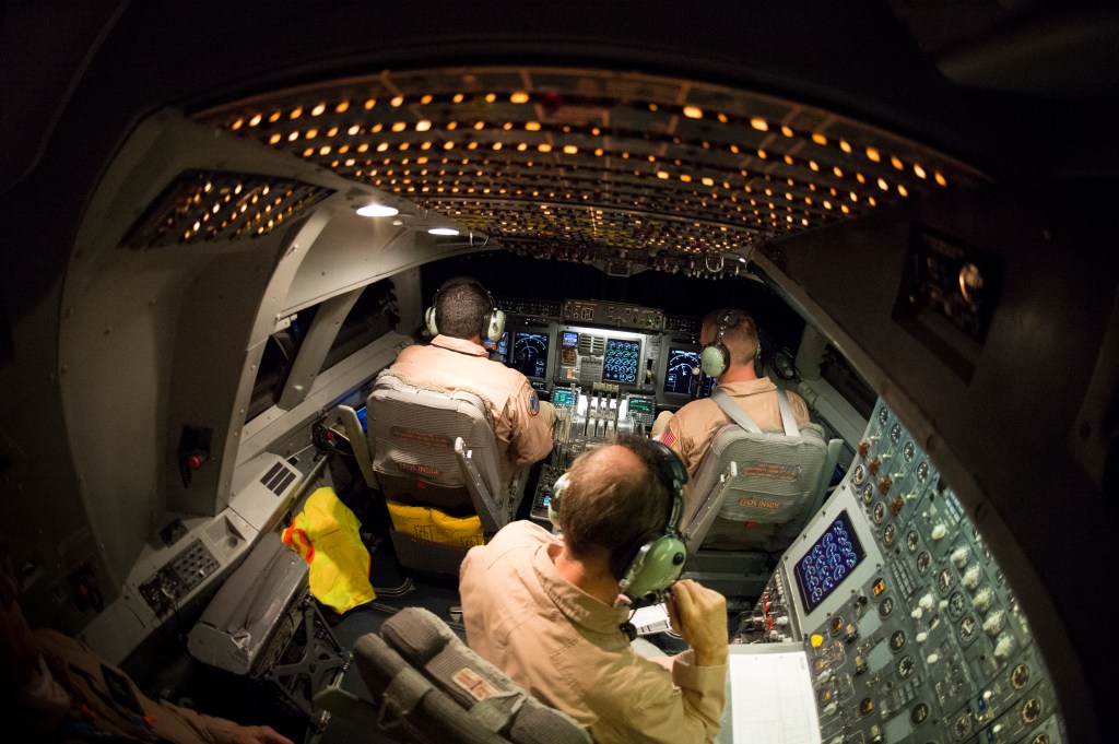 Flight crew works during SOFIA flight.