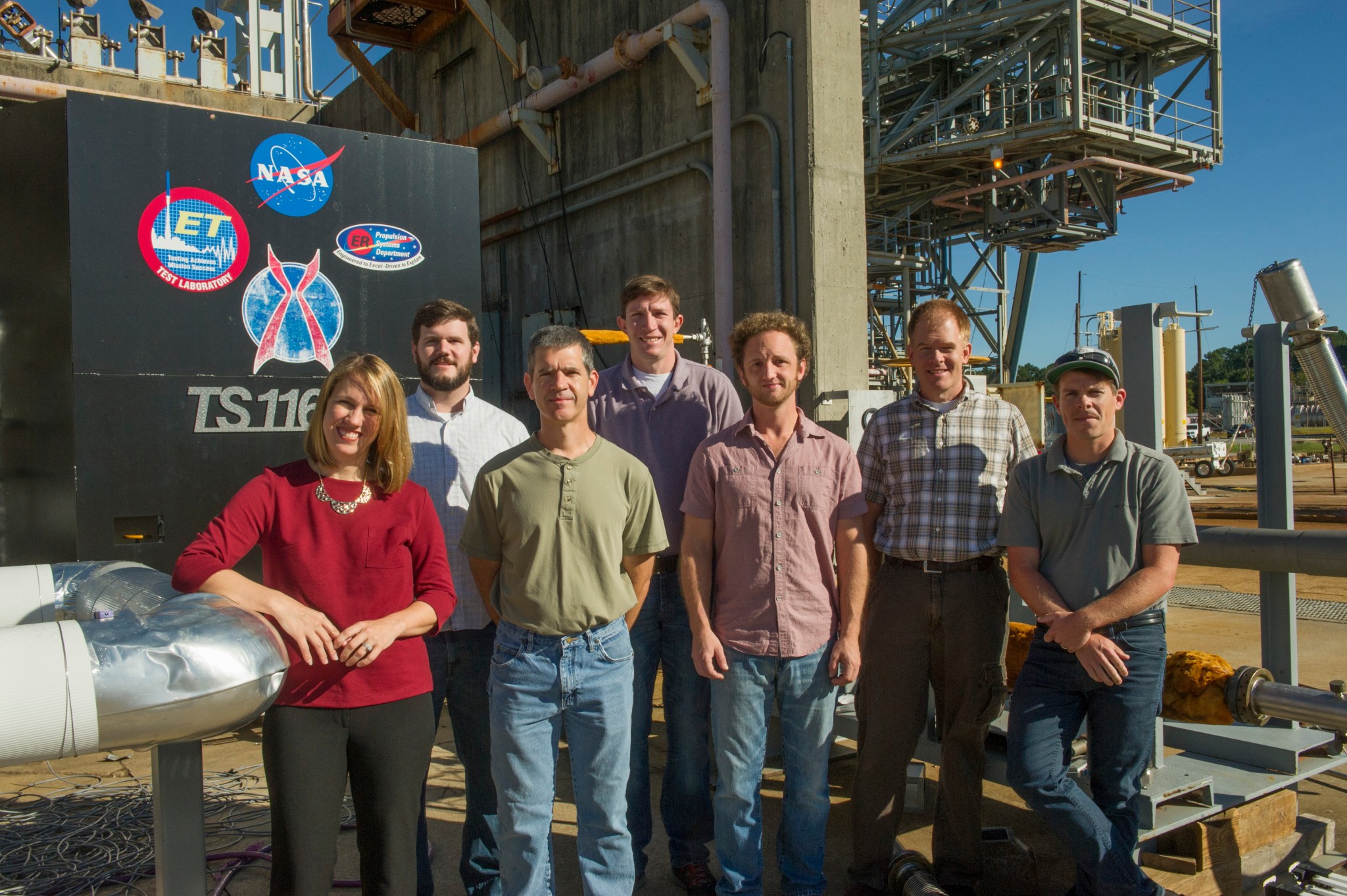 The team of Marshall engineers, who designed and tested a 3-D printed demonstrator engine.